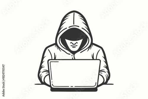 Silhouette of hooded figure works on laptop; face hidden in shadows, mystery