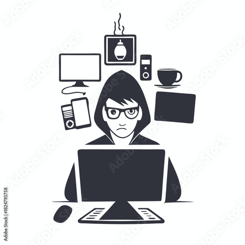 Serious hooded Asian coder sits at a busy desk working on a computer