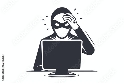 Worried hacker in mask sits before computer, touching head in frustration with the situation