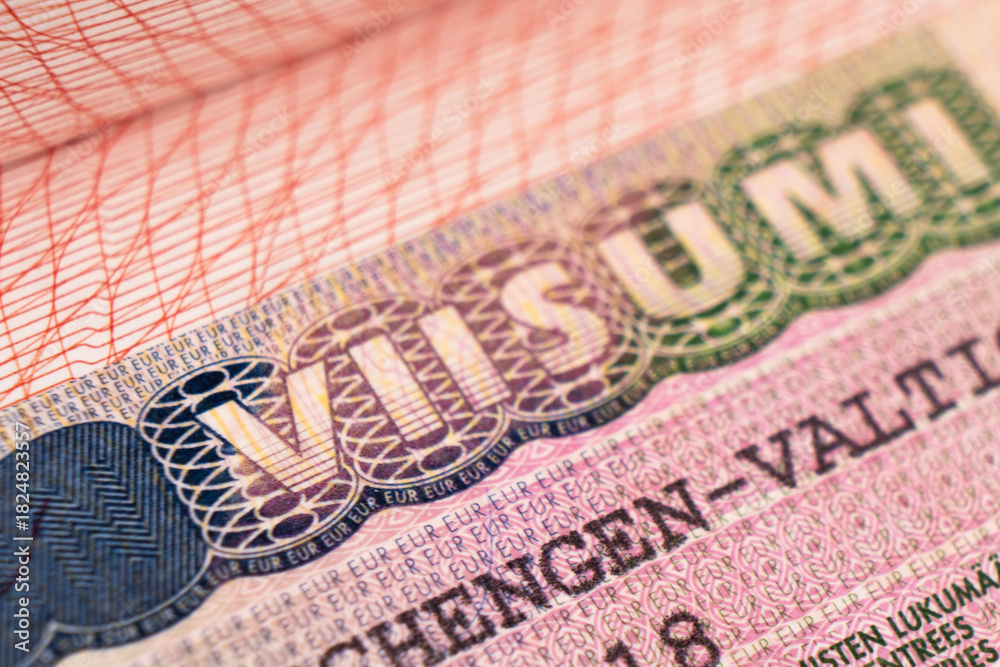 Fototapeta premium Schengen visa of Finland on the page of the passport. Part of suomi shengen visa close up