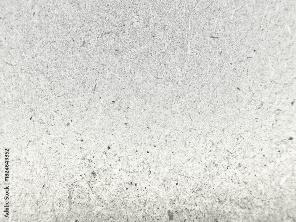 Fototapeta premium close up white fibrous paper texture with black specks
