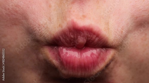 Rinsing mouth motion with closeup view of tightened lips creating a swirling cheek movement