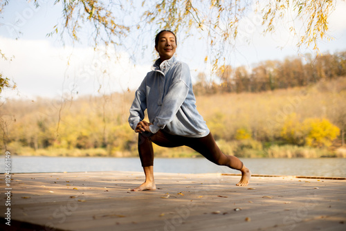 Korean woman practices yoga...