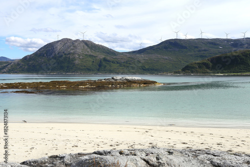Stunning and idyllic Sommaroya islands landscape by the turquoise sea with white sand beaches. Atlantic shore near Sommarøy, Norway.