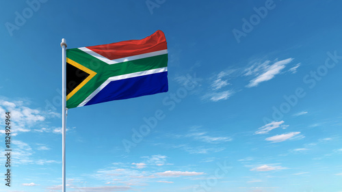 South African flag waving proudly against a clear blue sky on Independence Day