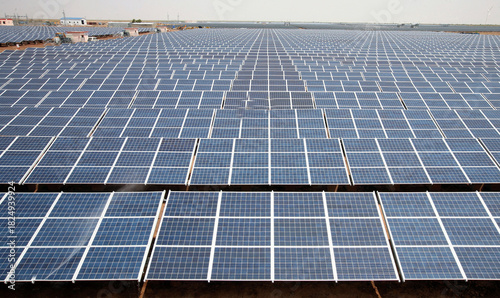 Vast array of solar panels covering a rooftop generating renewable energy