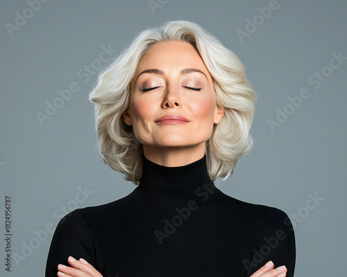 <center>Radiant Aging: Mature Woman Radiating Happiness and Glowing Skin with Natural Cosmetics and Gentle Skincare Routine on Neutral Gray Background</center>
