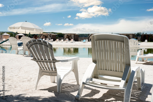 Wallpaper Mural White deck chairs at a recreation center with a freshwater lake Torontodigital.ca