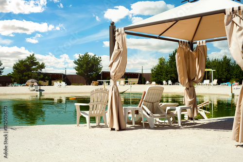 Wallpaper Mural Recreation complex with sun loungers and a covered tent with a pond in the middle Torontodigital.ca