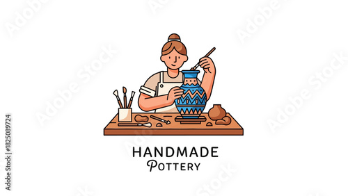 A person with a bun paints a vase with blue designs on a wooden table with brushes and clay items