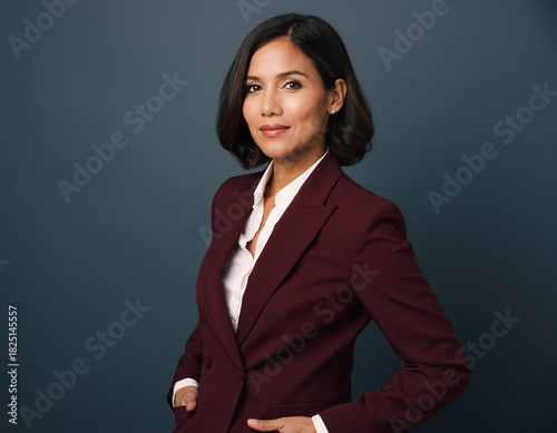 Confident businesswoman in stylish suit looking forward, ready for success, portraying strength and leadership in the corporate world, career-focused and empowered