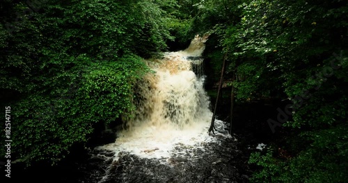 Aerial shot of waterfall in a river