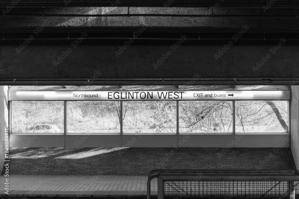 Fototapeta premium black and white representation, interior sign of Eglinton West subway station, line 1, Toronto