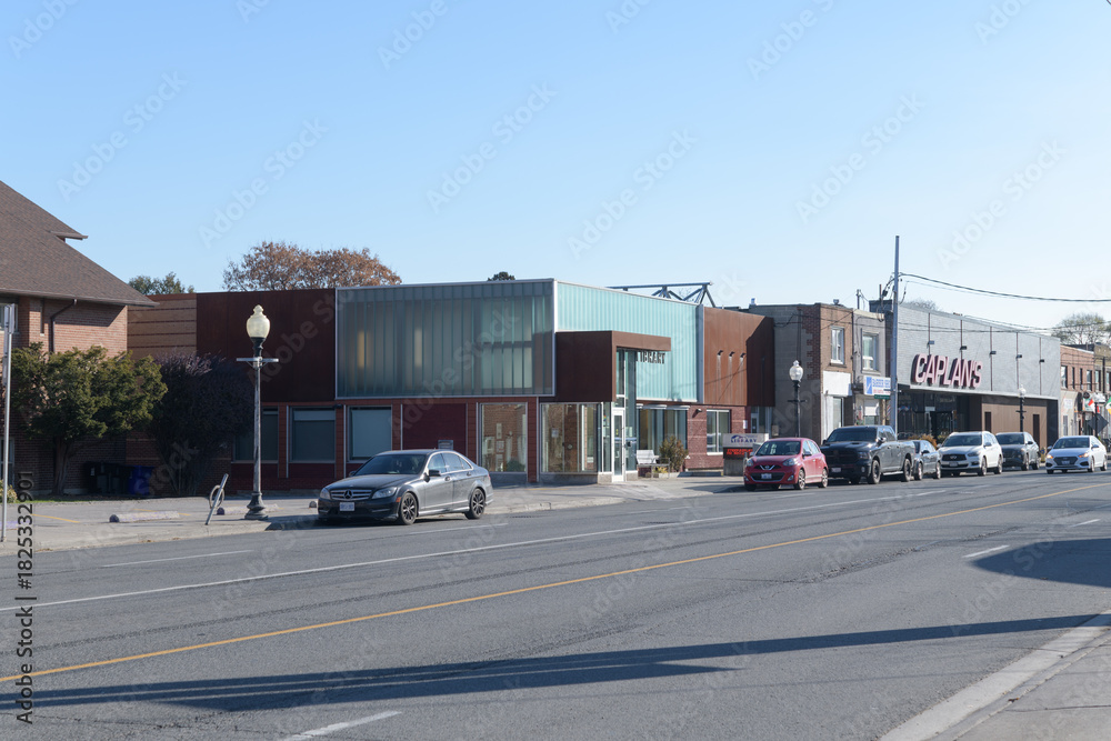 Fototapeta premium looking southeast on Weston Rd to Toronto Public Library - Mount Dennis Branch shops and Caplan's Appliances, Toronto