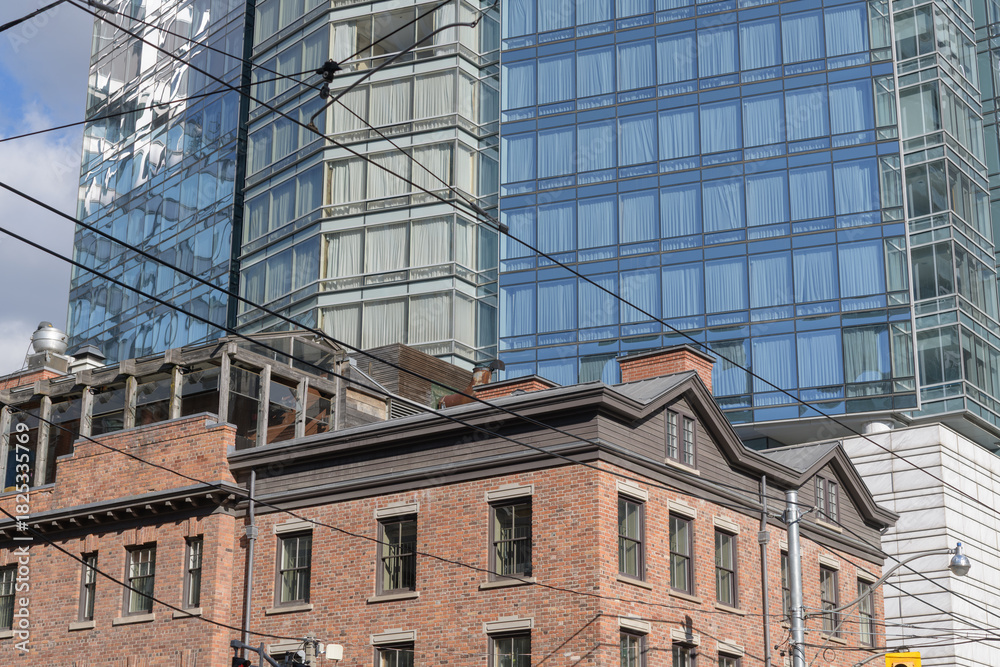Obraz premium roofline of Bishops Block, historic buildings, and west facing elevation of Shangri-La Toronto, a hotel