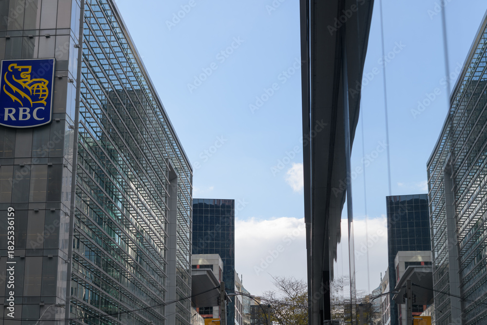 Fototapeta premium corporate logo outside RBC Centre and reflection of office buildings in a nearby structure, Toronto