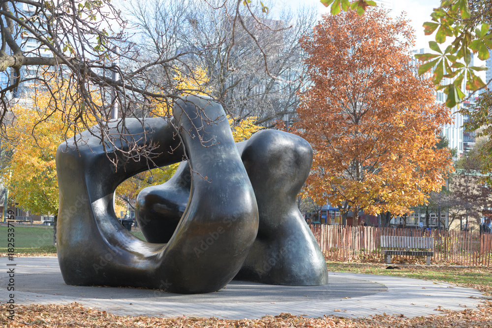 Fototapeta premium view of Henry Moore's sculpture Large Two Forms installed in Grange Park, Toronto