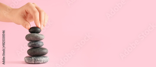 Hand putting pebbles in sta...