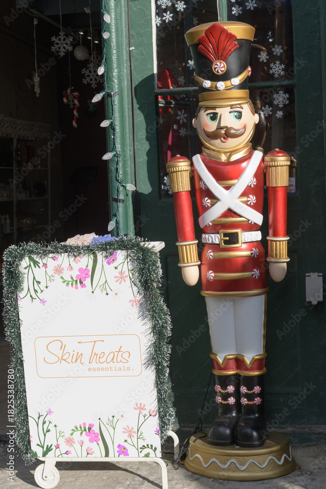 Fototapeta premium toy soldier holiday decorative figure outside Skin Treats, a facial spa, located at 13 Trinity St, The Distillery Historic District, Toronto
