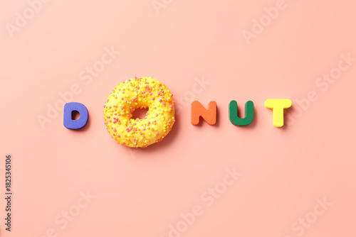 Word DOUGHNUT on pink backg...