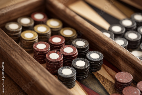 Colorful game pieces displayed in a wooden board for competitive play during an indoor gathering