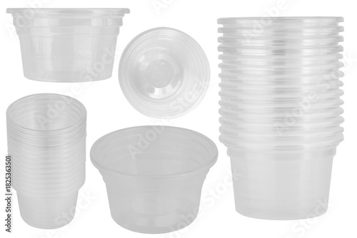 Clear plastic dipping sauce cups stacked on a white background