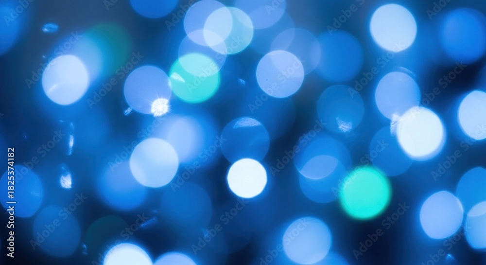 Obraz premium Blue and white bokeh lights with a blue background.
