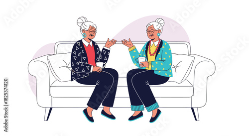 Two stylish elderly women friends sitting on a comfortable sofa, enjoying a conversation and drinking coffee together in their leisure time.
