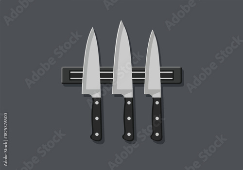 Three chef knives held on a magnetic strip against a dark gray wall