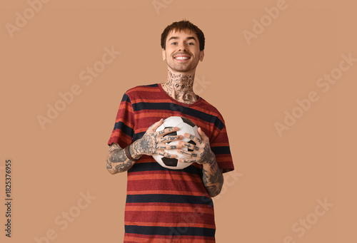 Happy young man with soccer...