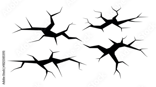 Four Black Irregular Crack Shapes on White Background