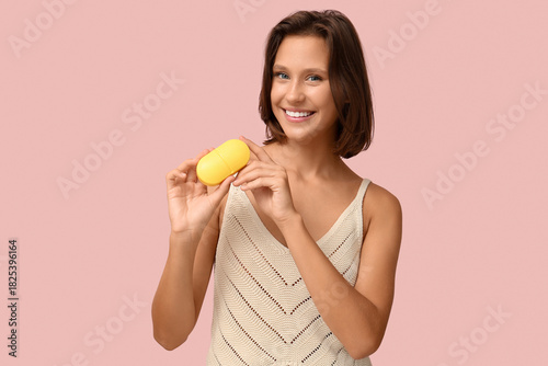 Pretty young woman with pil...