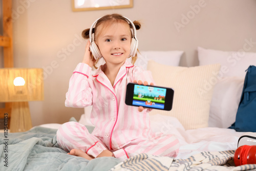 Cute happy little girl in h...