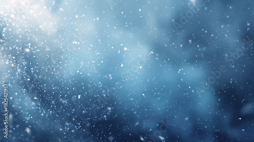 Blue winter snowfall bokeh background with falling snowflakes and soft abstract blur