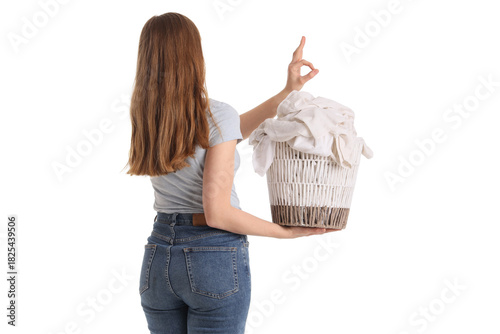 Young woman holding laundry...