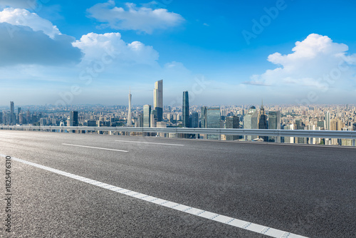 Empty asphalt road and city skyline with modern buildings in Guangzhou