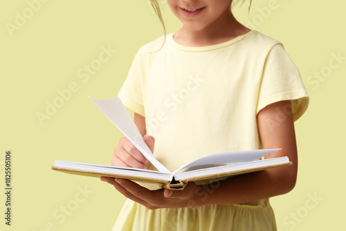 Adorable little girl readin...