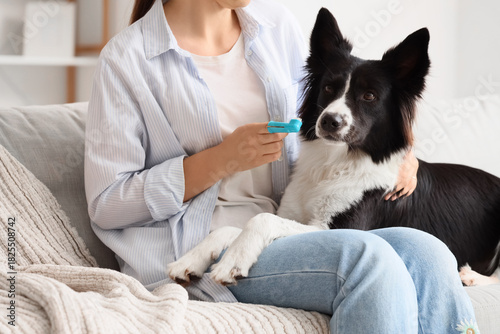 Owner brushing teeth of cut...