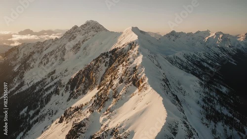 Majestic Mountain Range at Sunrise - A Breathtaking Aerial View.