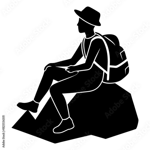 Silhouette of a hiker with a backpack sitting on a rock