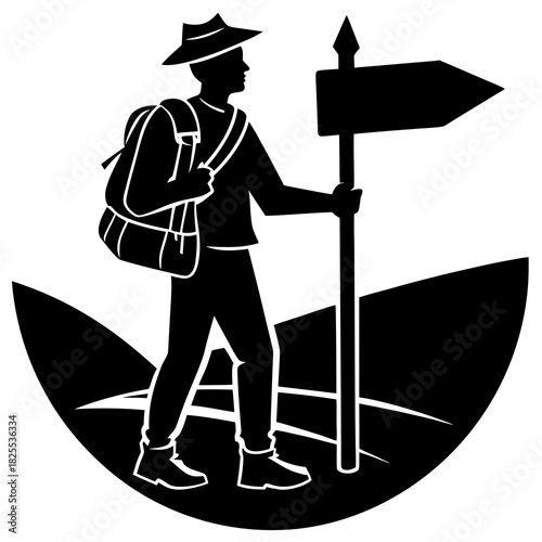 Silhouette of a hiker with a backpack and a signpost