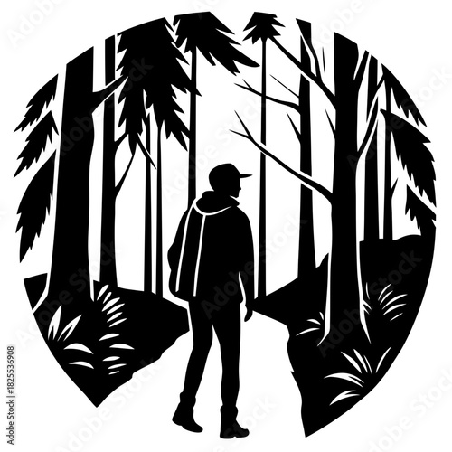 Silhouette of a hiker walking on a path through a forest