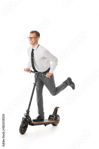 Young businessman riding el...