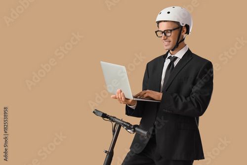 Young businessman with lapt...