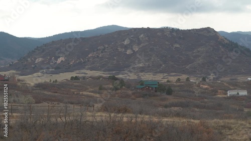 Aerial of homes in Sedalia Colorado in fall in grassy front range hills