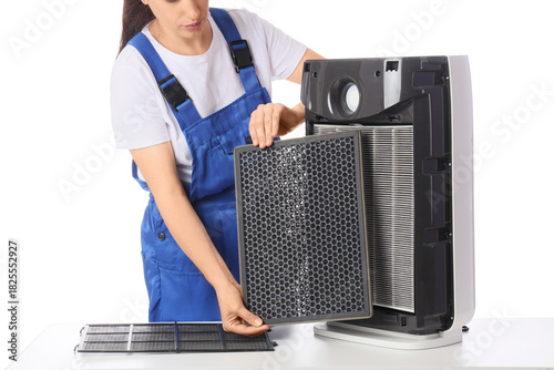 Female technician changing ...