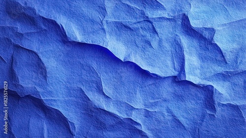 Wallpaper Mural crumpled blue paper with layered torn edges and deep folds, textured abstract ridges evoking a calm, contemplative cool mood Torontodigital.ca