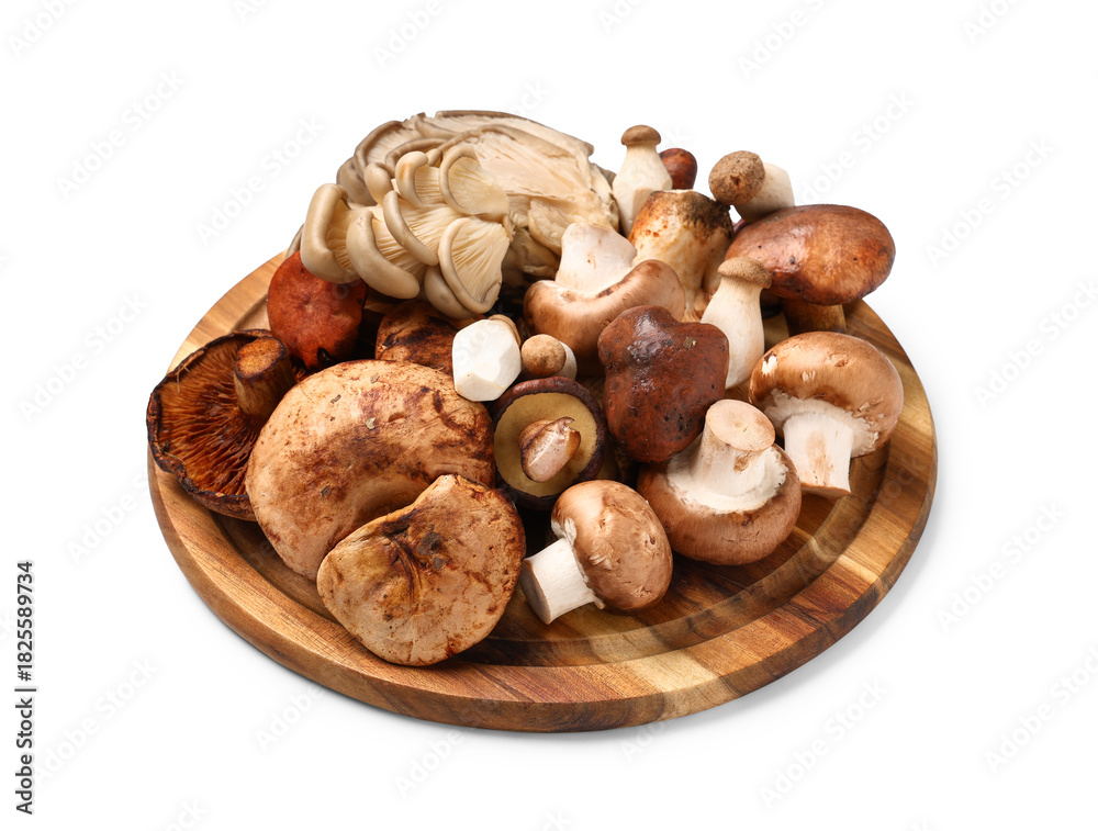 Obraz premium Wooden board with different fresh mushrooms on white background