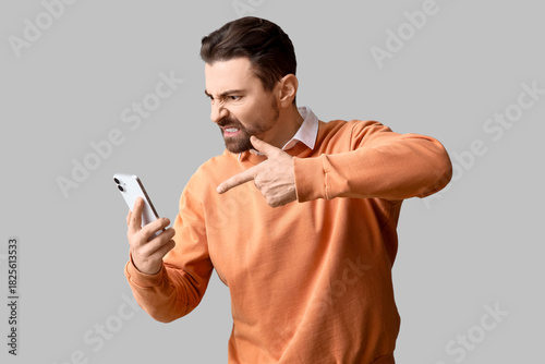 Angry male office worker po...