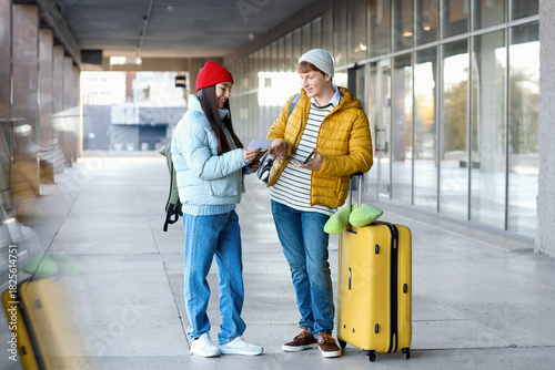 Young couple with passports...